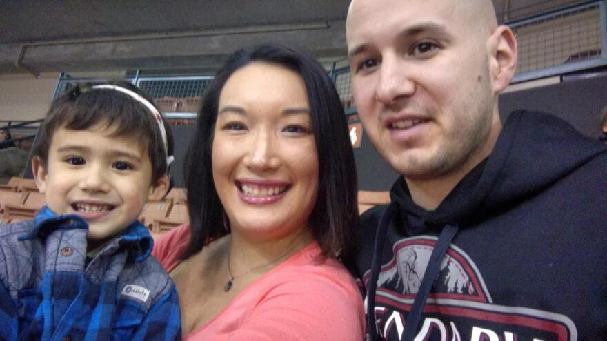 Nancy Glynn, her husband, Michael Gebo, and their son, Hunter, attend a minor league baseball game near their home in Manchester, N.H.