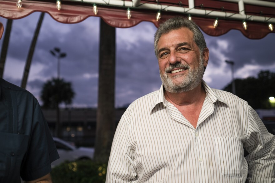 Felipe Valls Jr. stands in front of the ventanita window at Versailles Restaurant in Miami's Little Havana neighborhood on December 5, 2022.