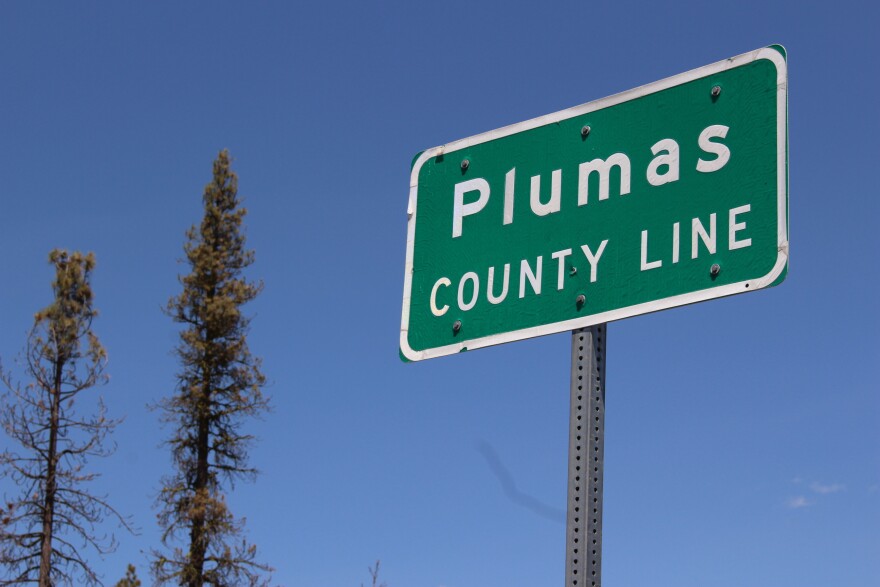 A sign marking the Plumas County line.