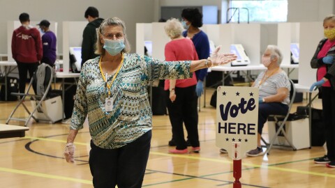 Poll worker at UNCC's Belk Gymnasium