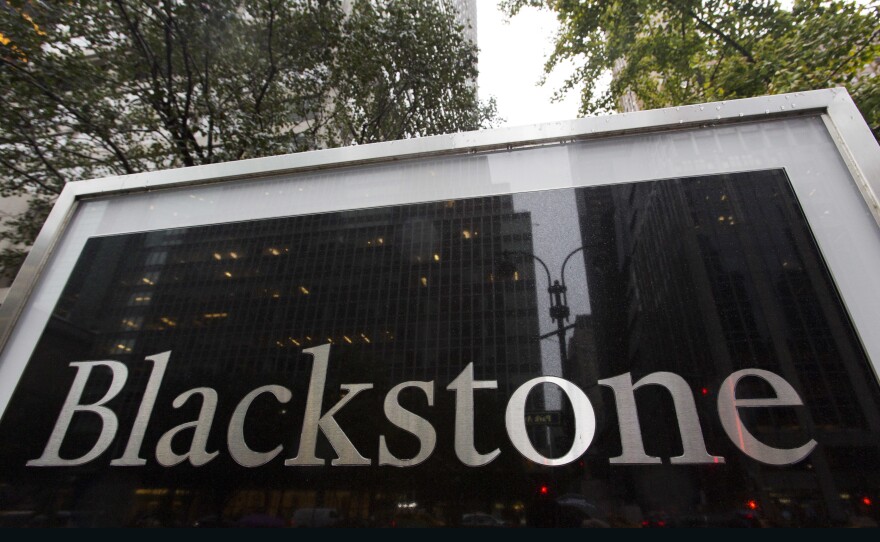 FILE - A sign for The Blackstone Group L.P. investment firm stands in front of their offices, Oct. 15, 2018, in New York. Blackstone Group is a private equity firm.