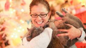 Marci Bowling, founder of Watching over Whiskers, holds a cat (submitted photo).