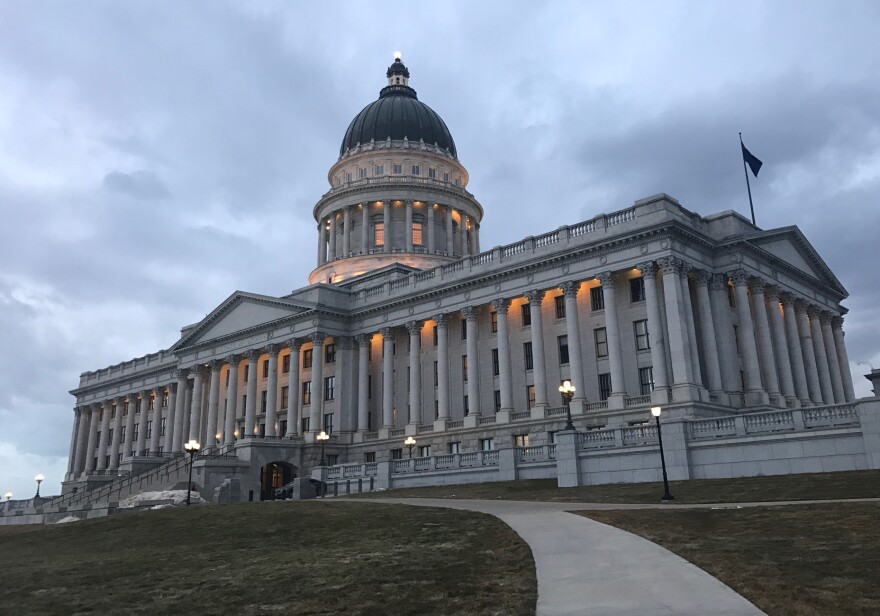 A photo of the Utah State Capitol at night. 