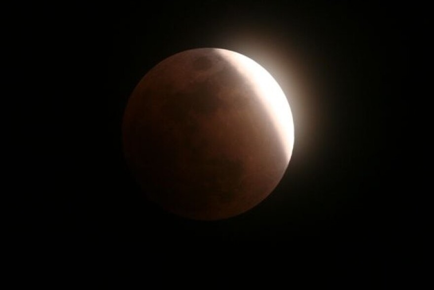 A photo from a previous year's lunar eclipse shows what to expect about midnight on Aug. 27-28 for the partial lunar eclipse.