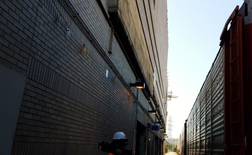 The red arrow in this October 2017 image indicates the back wall of the Omnimax Theater, which had to be replaced. It's about 40 feet tall, 100 feet wide, 20 feet off the ground, and 15 feet away from an active rail line.