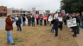 Demonstrators outside the Norman City Hall before a city council committee met to discuss changes to oil and gas drilling rules.