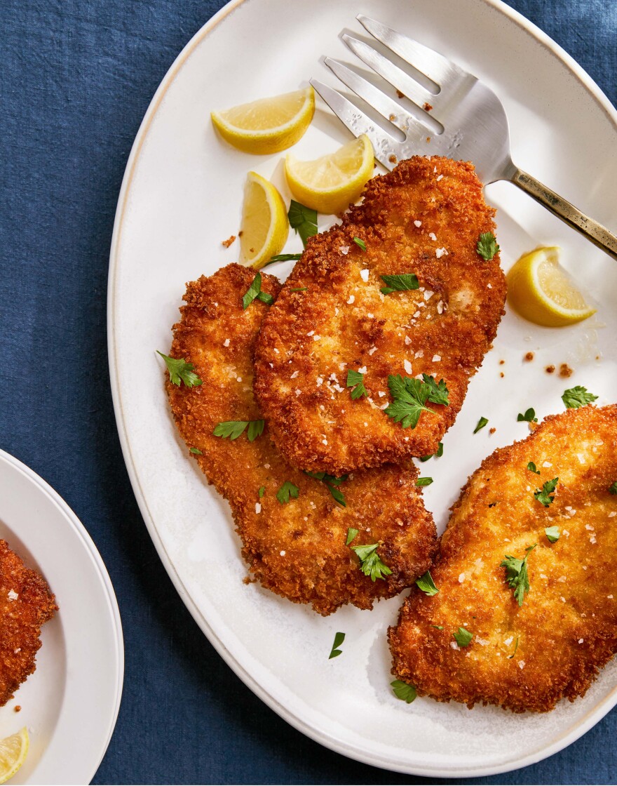 Chicken patties on a white plate.