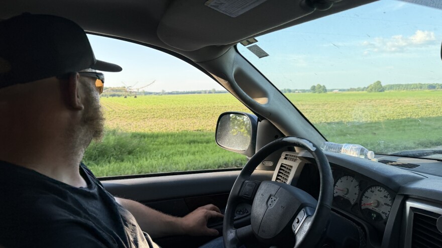 Wexford Township resident Jake Kerby looks out at farmland. Early plans from a renewable energy developer could line the field with solar arrays. (Photo: Vivian La/IPR News)