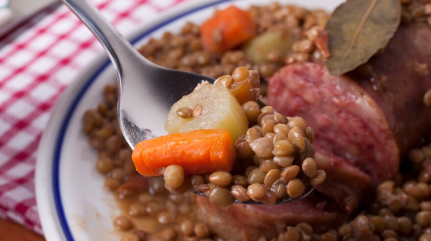 Italians munch on coin-shaped lentils with <em>cotechino</em>, a pork sausage that symbolizes the fat of the land.