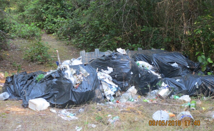 Illegal dumping near the unofficial pit contributes to the sense of lawlessness in the area, residents say.