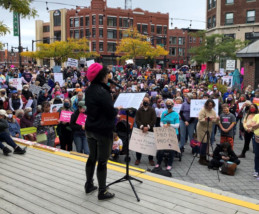 Abortions rights activists speak to supporters in Portland Saturday.