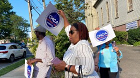 Rhonda Benn, center, a food service worker at Norwalk Hospital walks out of the Cornerstone Community Church on Wednesday night Aug. 09, 2023 after workers voted 45 to 3 to join a union.
