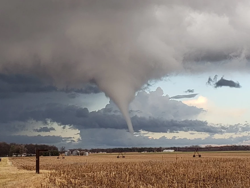 tornado moves across farm field