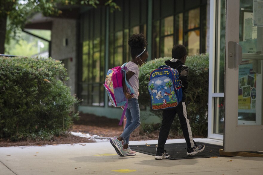 Students enter Atlanta's Beecher Hills Elementary School in August.
