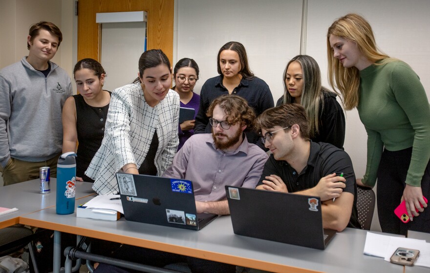 Students at the Center for Ethics and Public Service meet with Emily Balter (standing, center left), the center’s practitioner-in-residence.
