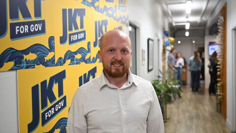 Jonathan Kreiss-Tomkins poses at his primary election night party the The Rail in Anchorage on Aug. 18, 2026.