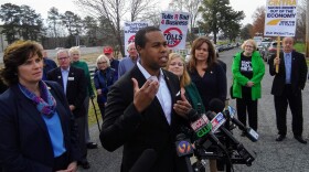 State Rep. Chaz Beasley talks to reporters in Cornelius Monday about a bill he and other lawmakers are poposing to remove what they say are "roadblocks" to renegotiating the I-77 toll lanes contract. 