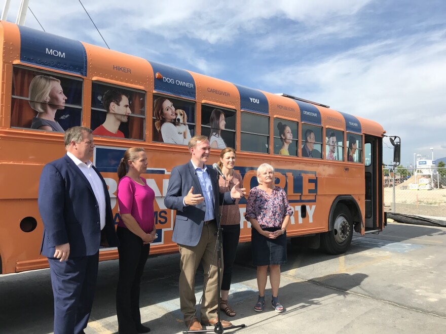 Ben McAdams and staff in front of campaign bus.