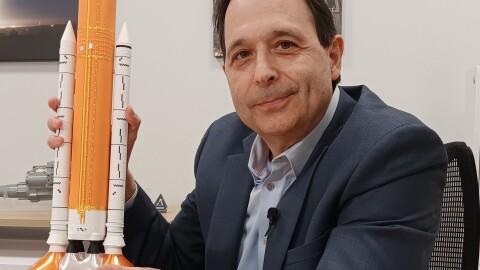 Jim Steffan, Programs Director of Space Actuation Systems at Moog, Inc., holds up a model of the rocket which launched the Artemis II from earth into space Wednesday, April 1, 2026. Moog produced several components being used in the moon mission.