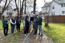 Lackawanna County Commissioner Debi Domenick, chair of the county's land bank, hands over the deeds to two properties to Jenna O'Malley and Corey Walsh.
