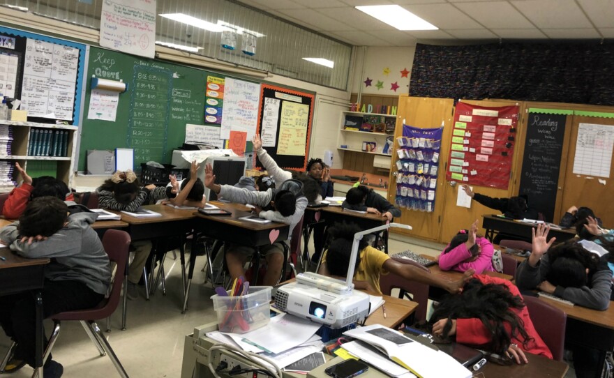 Kayla John's students vote for the group they think did the best job reading poems aloud together on Jan. 25, 2019.