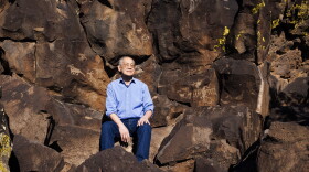 Poet Laureate Arthur Sze hikes among ancient indigenous rock carvings that inspired some of his work at La Cieneguilla Petroglyph Site near Santa Fe, New Mexico, March 12, 2026.