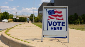 A voter makes her way inside Saginaw United high school to cast her ballot in the August 4 primary election.