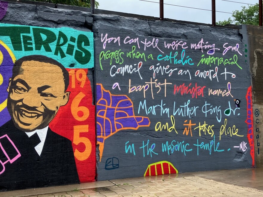 The right edge of the mural includes a quote from Rev. Dr. Martin Luther King, Jr., when he received the Pacem in Terris Award in April 1965 at the Davenport Masonic Temple.