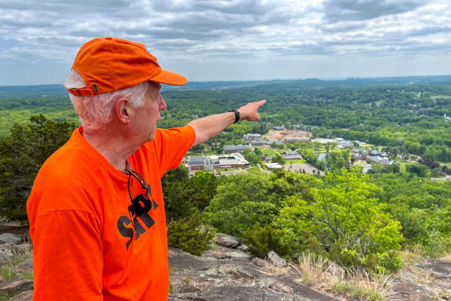 FILE: Volunteer trail guide and Sleeping Giant Park Association board member Mick Martucci points out sites of interest during the park’s first guided hike of 2023 on May 21.