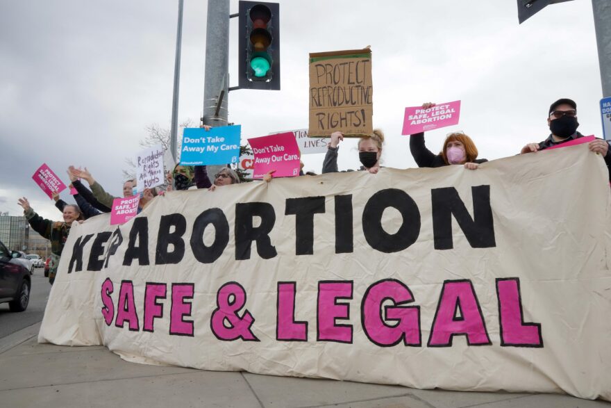 Roughly 200 people gathered at rush hour in Midtown Anchorage in May to rally for the protection of reproductive rights.