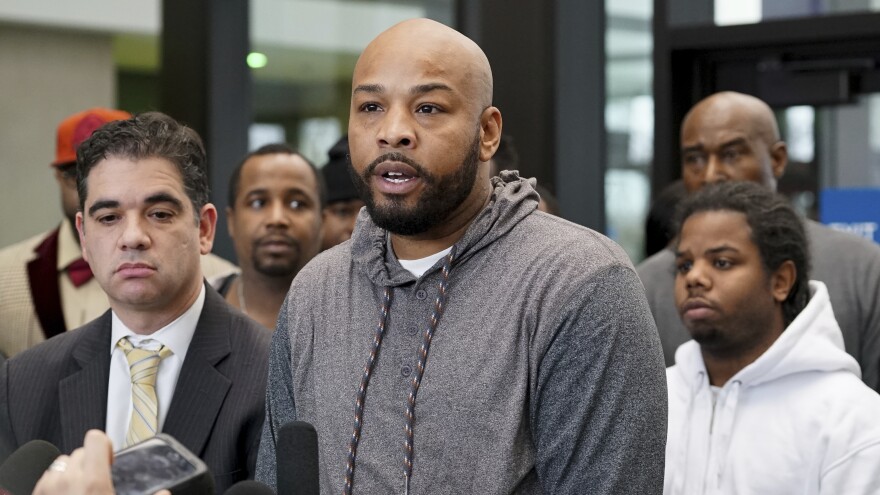 Leonard Gipson, one of 15 men who say corrupt Chicago police framed them and whose convictions were thrown out, talks to reporters Thursday.