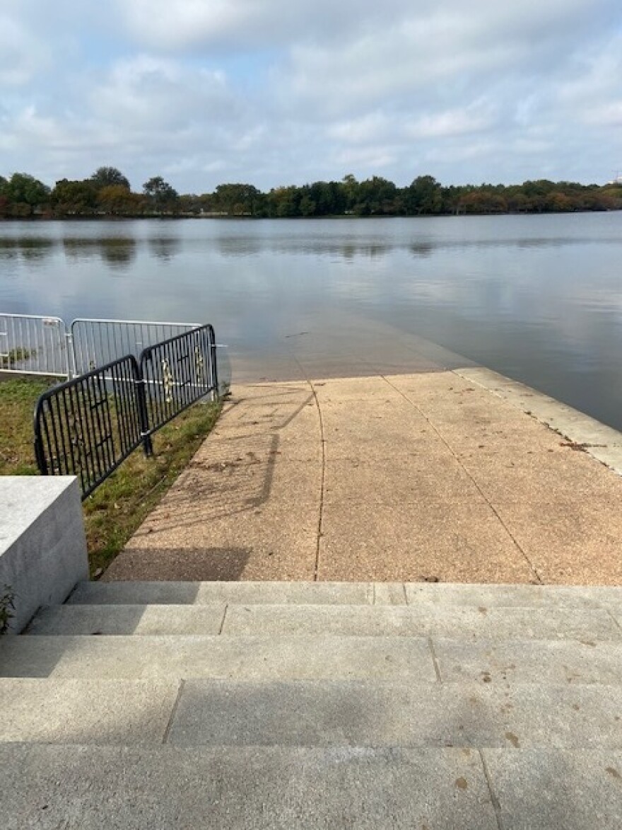 A walkway at the Tidal Basin is covered with water.