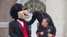 Lucy the Bearcat with the UC Bearcat mascot and her handler.