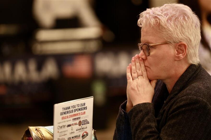 Audrey Rodriquez of Rochester reacts to news that Kamala Harris won New York state at the Monroe County Democrats' gathering at the Hyatt hotel in downtown Rochester.