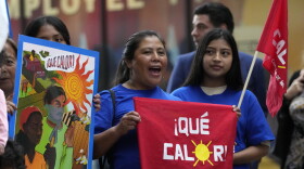 Members of WeCount, an organization of outdoor workers demanding workplace protections against extreme heat, chant before a news conference, Tuesday, July 18, 2023, at the Stephen P. Clark Government Center in Miami.  
