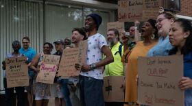 Tenant union members pose for a photo after their rally in front of Ocean Management's office. They delivered a signed letter stating they refused the rent increases.
