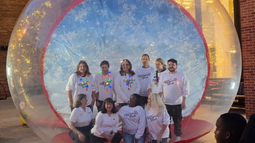 UA Little Rock leadership pose for a photo at the 2025 Winter Fest celebration.