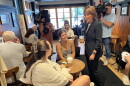 Helena Foulkes talks to patrons at Coffee Exchange in Providence the morning after her primary win. Credit: Ian Donnis/Ocean State Media