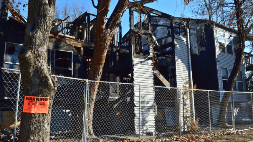 Remains of an Olive Park Village building that was involved in a fire two months prior.