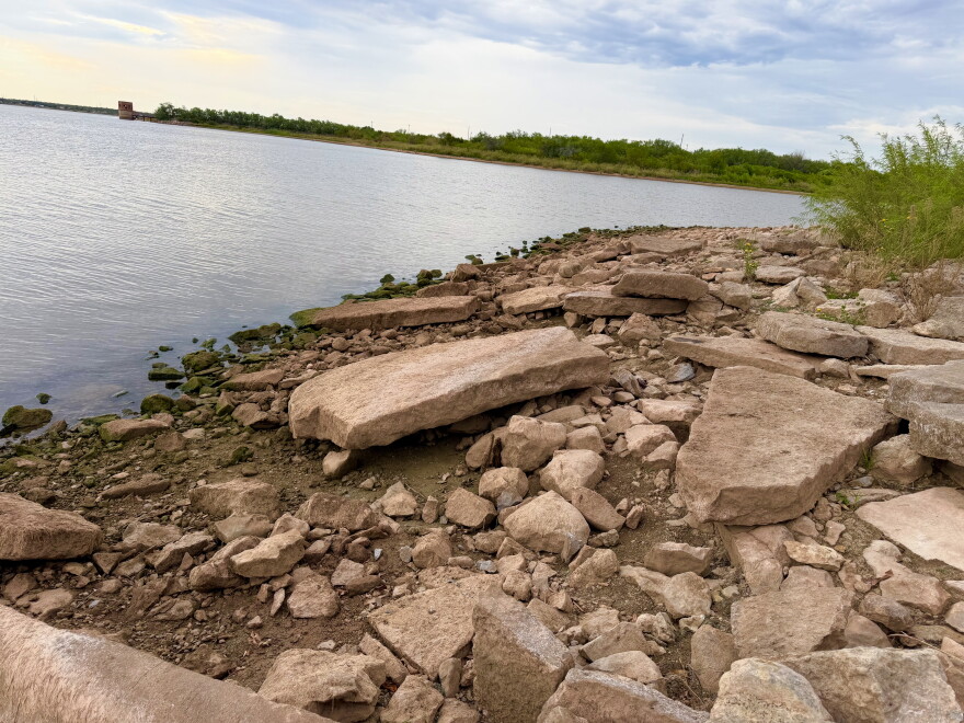 Limestone slabs line the shoreline at Lake Fort Phantom Hill north of Abilene on Sept. 16, 2026. Texas Parks and Wildlife biologists found zebra mussels in two to four feet of water along rocky banks like this one. Photo by Caysson Higgins.