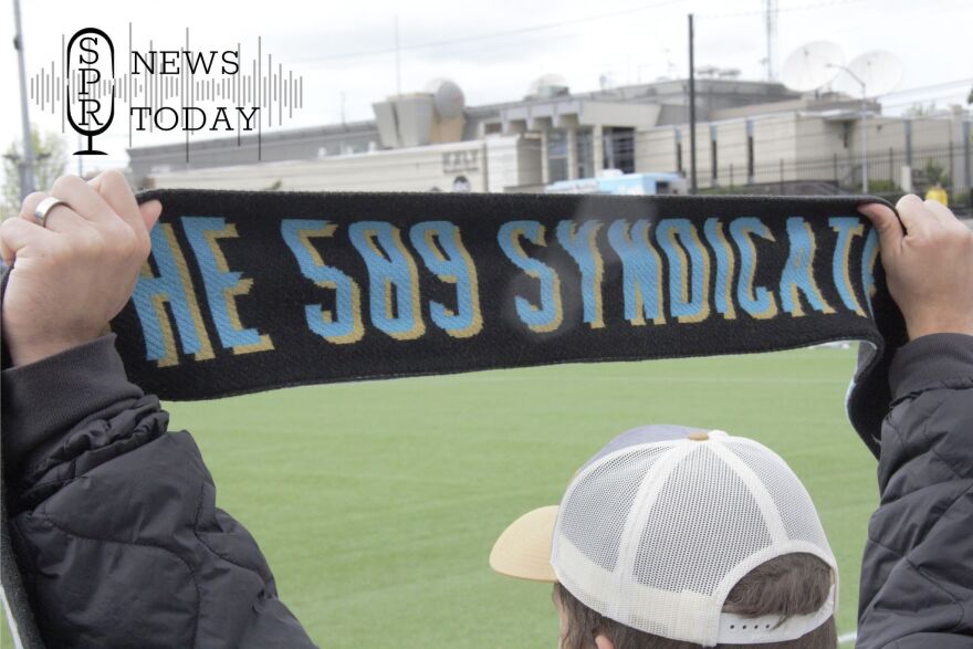 A member of the 509 Syndicate, Spokane's official soccer fan club, holds up a club scarf at the Spokane Zephyr's last game on May 16, 2026.