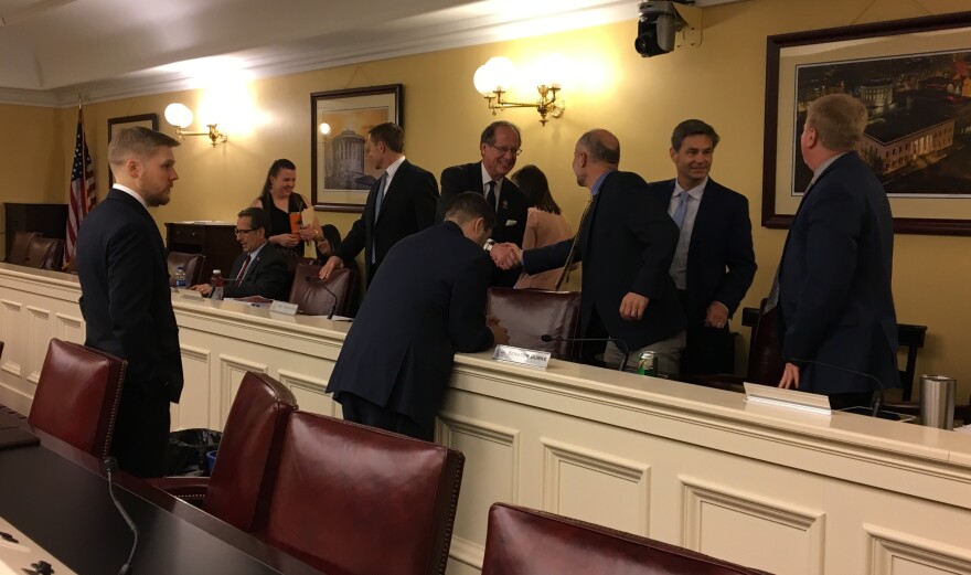 Sen. Dave Burke (R-Marysville, third from right) shakes hands with Rep. Scott Oelslager (R-North Canton) at the first meeting of the budget conference committee on June 25. 