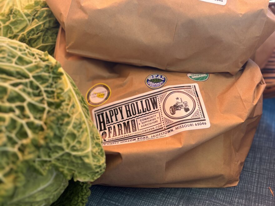 HProduce from Happy Hollow Farm at the Columbia Farmers Market in Missouri on Saturday, Dec. 7, 2024 sports various labels, including “USDA Certified Organic.” Farmer Liz Graznak said the label is valuable and recognizable to customers.
