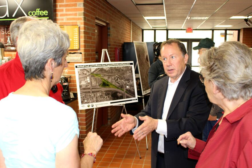 EPA Regional Administrator Doug Benevento talks with community members after an EPA meeting in Butte, May 2018.