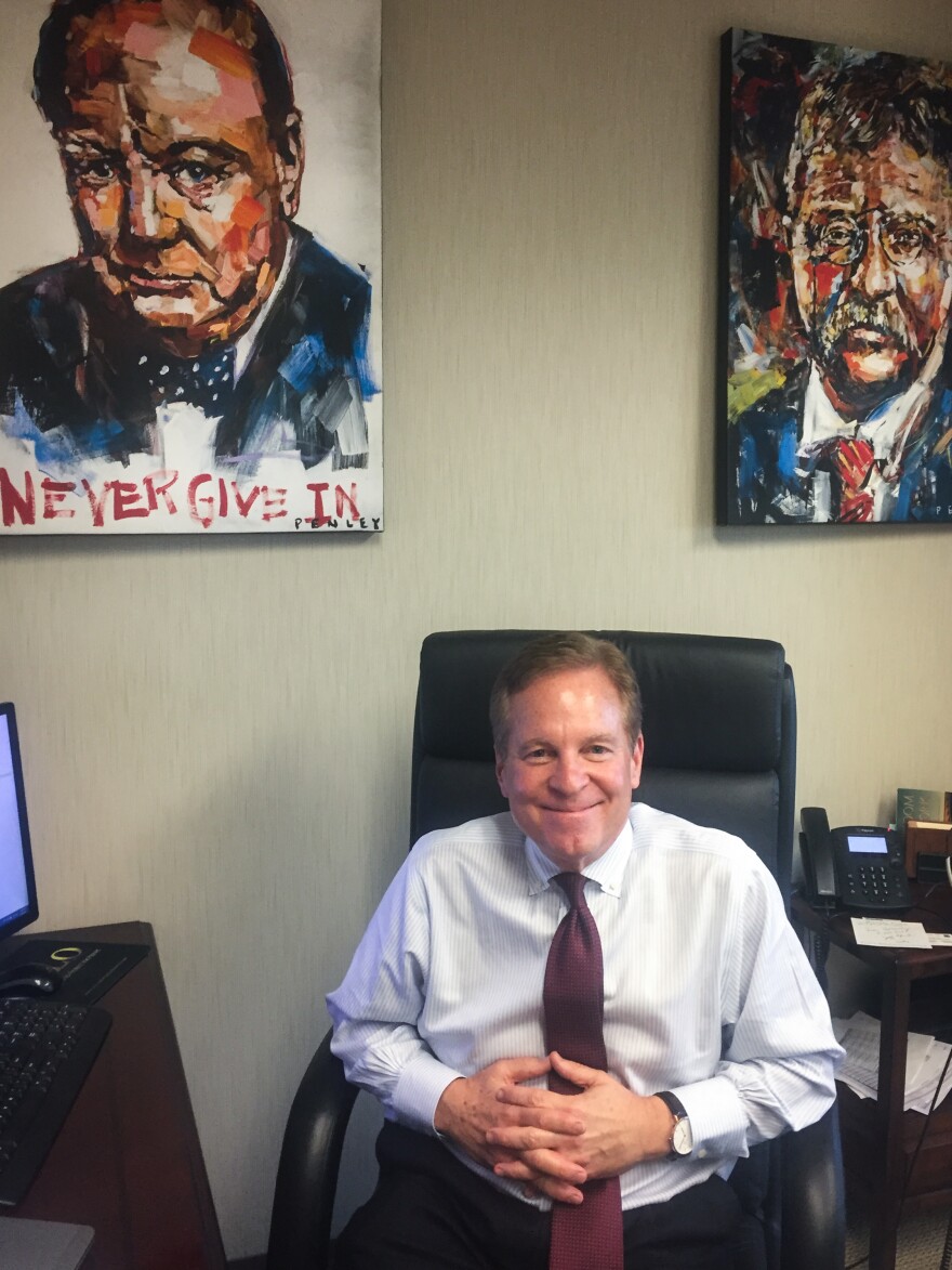 Flock Specialty Finance founder and CEO Michael Flock's desk is flanked by portraits of Winston Churchill and Teddy Roosevelt. He thinks President Trump can be a Republican reformer like Roosevelt.