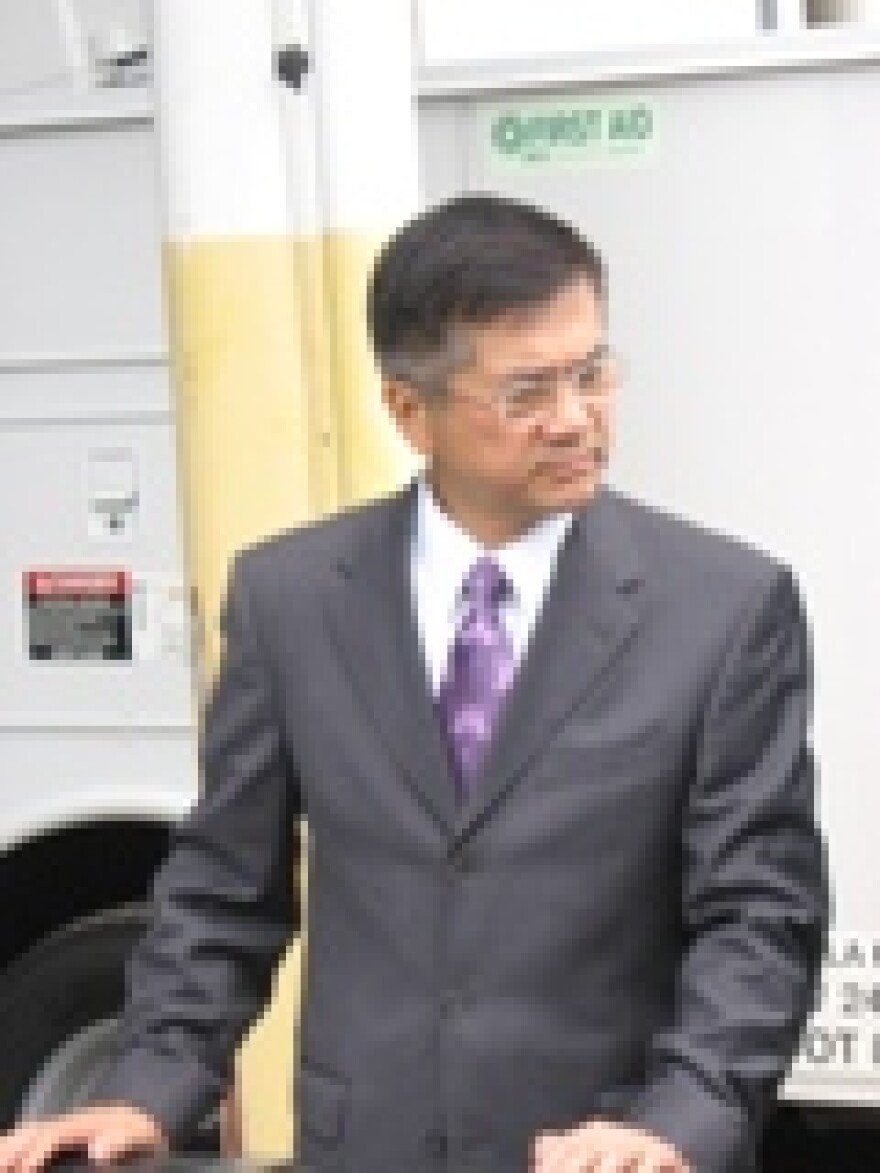 US Commerce Secretary Gary Locke checks out an electric truck made by Smith Electric Vehicles.