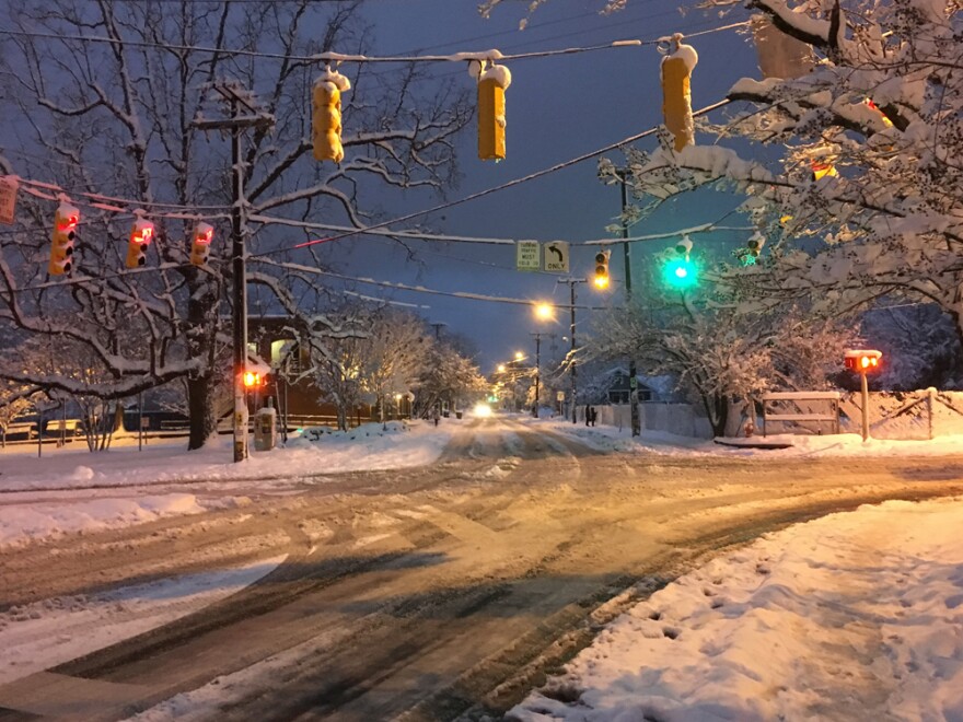 The intersection of Main and Greensboro Streets in Carrboro sits empty on Wednesday, January 17, 2017 after a snow storm dumped several inches of snow on the city.