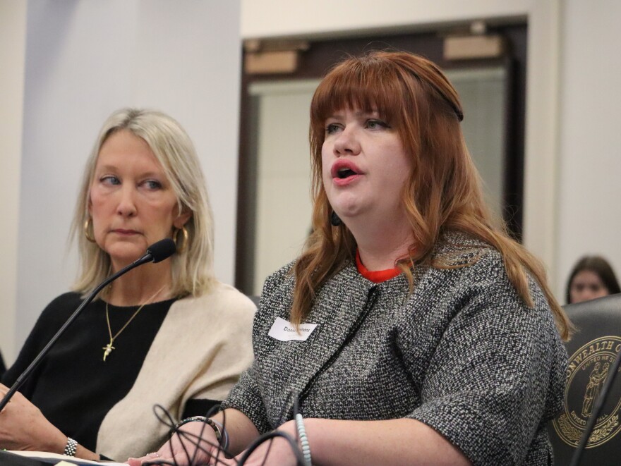 Advocate Donna Simmons sits beside GOP Sen. Julie Raque Adams as she describes the abuse and trauma she suffered as a result of her child marriage. Raque Adams was presenting Senate Bill 156, to close the final loophole in the state's ban on child marriage.