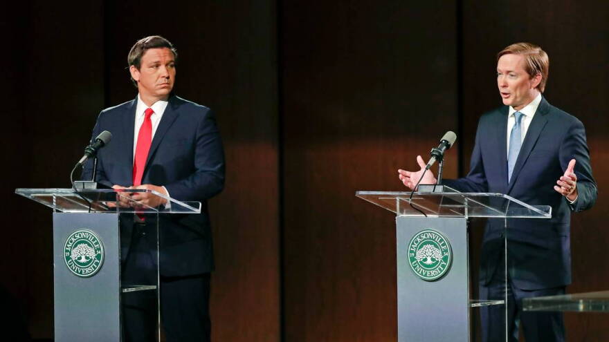 The Republican candidates for governor debated in Jacksonville on Wednesday, Aug. 8, 2018. Ron DeSantis, left, listens as Adam Putnam makes a statement. 