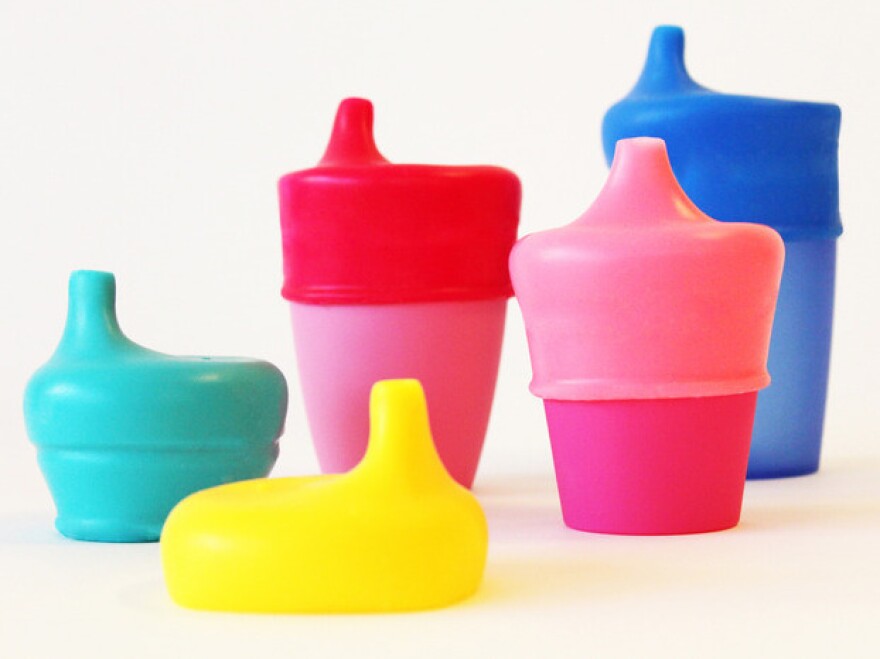 SipSnap lids come with straw holes or with spouts, like these.